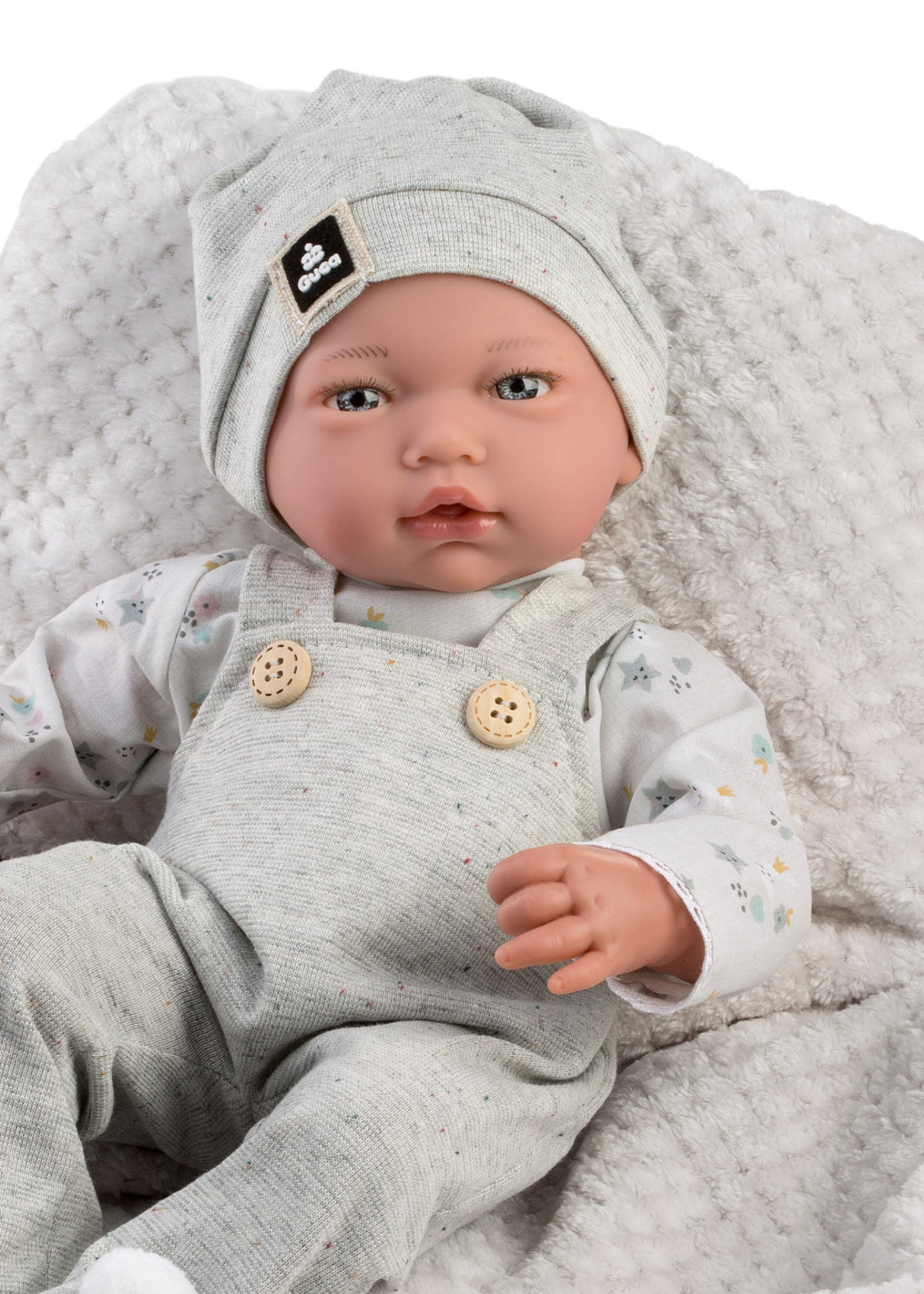 Papusa Liam, 38 cm, Fara Par, Corp Vinil+Textil, Mecanism cu Salopeta Gri si Paturica Alb-Gri cu Blanita 961 Guca Munecas